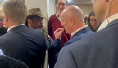 Christopher Luxon in Rotorua: Minister Todd McClay gets between Luxon and angry local at public meeting