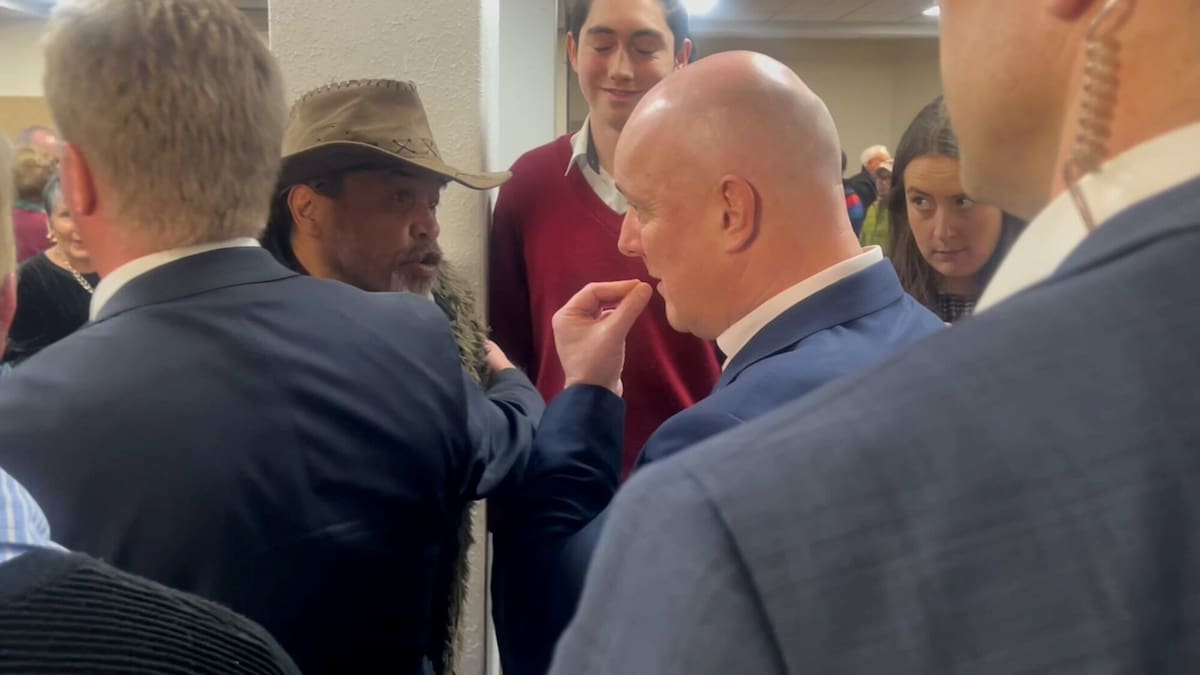 Christopher Luxon in Rotorua: Minister Todd McClay gets between Luxon and angry local at public meeting