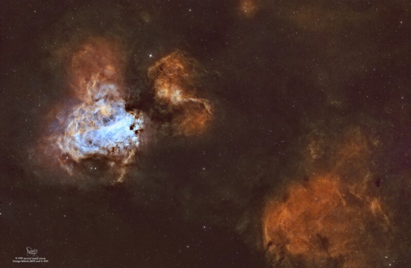 Two large, irregular clouds, one blue and one orange, plus numerous faint stars.