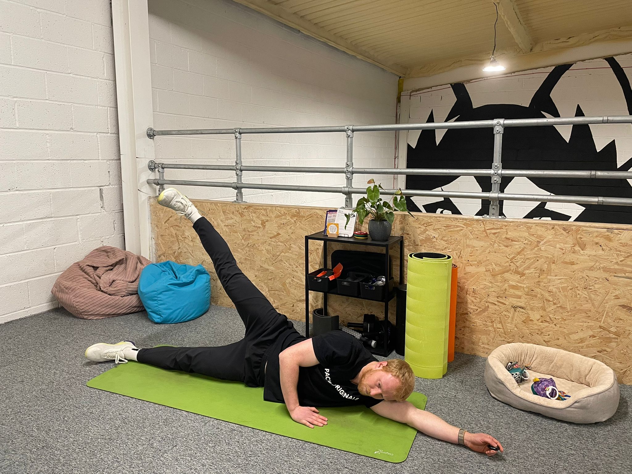 The Independent's fitness writer Harry Bullmore performing a side leg raise