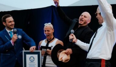 Pitbull breaks Guiness World Record for largest gathering of people wearing bald caps