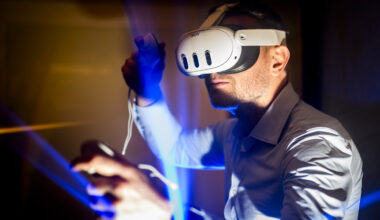 A person wearing a VR headset demonstrates a game design.