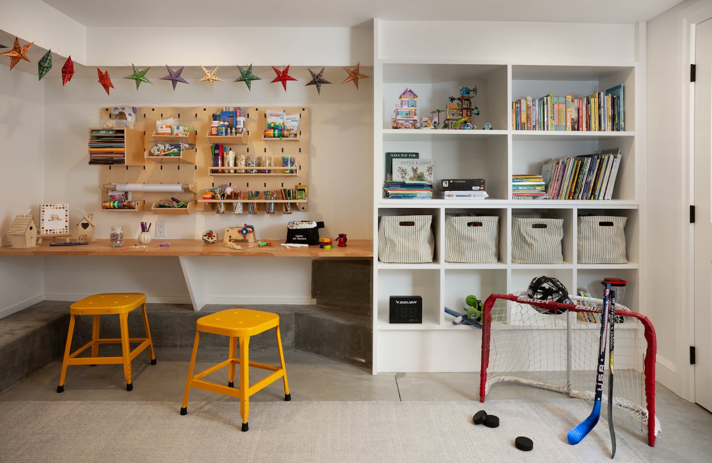 A crafting area with a built-in desk and built-in shelves to the right of it.