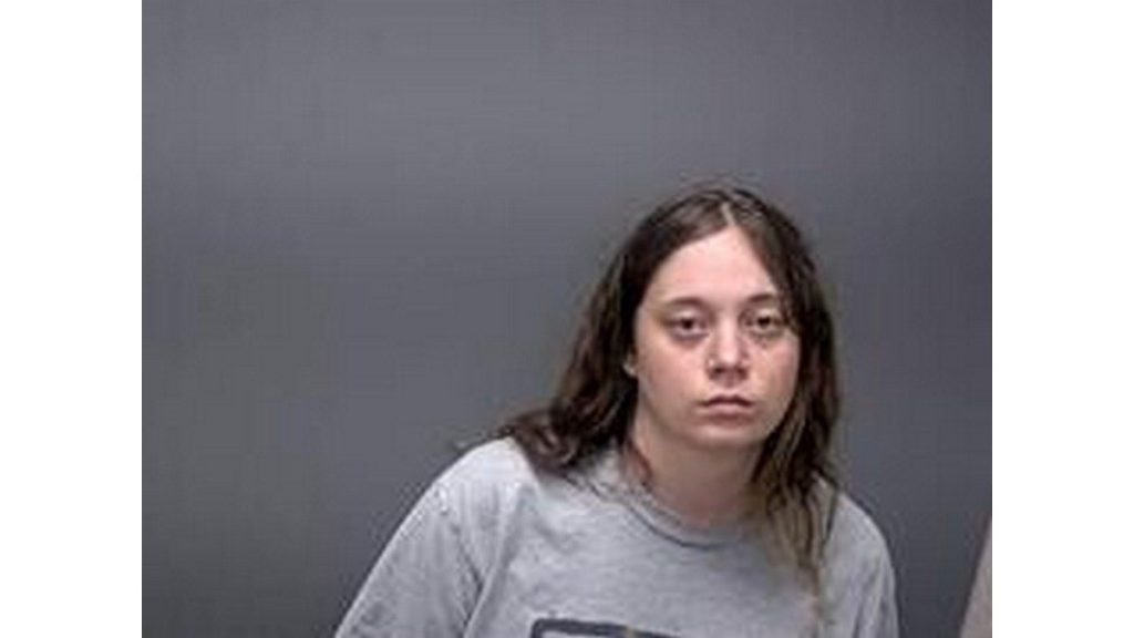 Woman with severe mental problems sitting in jail cell waiting on treatment