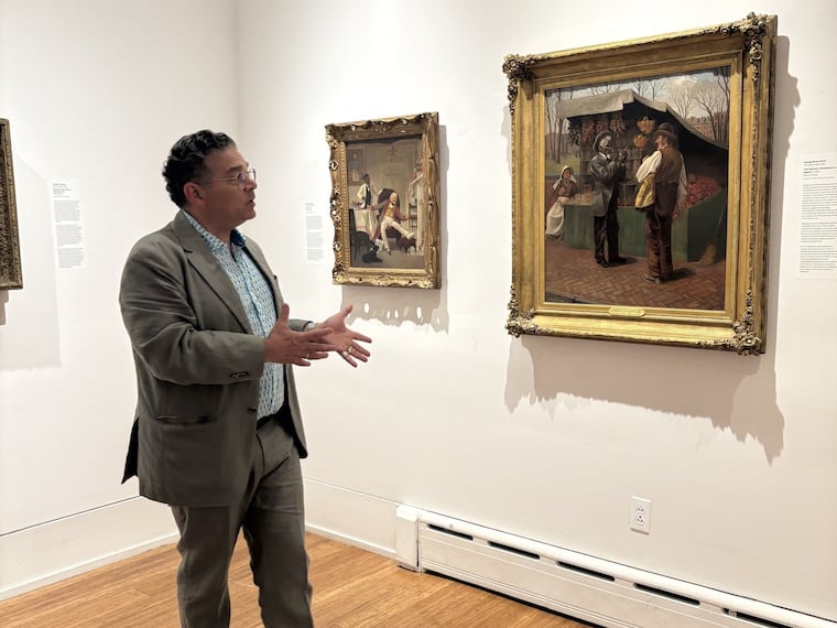 Woodmere director Bill Valerio stands in the Antonelli Gallery at the opening of the Chestnut Hill museum's  'Arc of Promise' exhibition featuring the work of Philadelphia artists who painted Black people with humanity during the Civil War era.