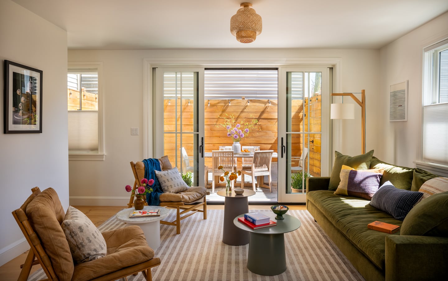 A living room with a patio door leading outdoors.