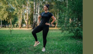 Woman doing standing ab exercises in park wearing activewear
