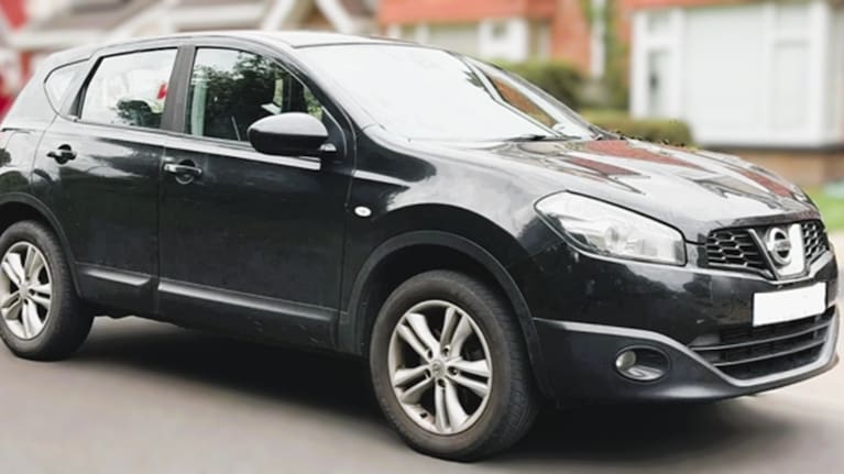 A 2010 black Nissan Qashqai.