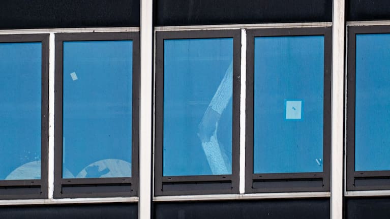 A buckled support beam is seen inside 235 East 42nd St in New York.