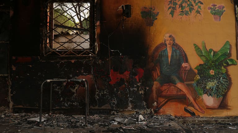 A campsite's bungalows are charred after it was ravaged by a wildfire in Pelayos de la Presa, Madrid province, Spain.