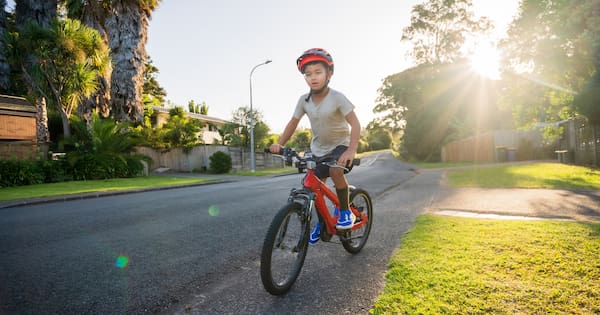 Kids to be able to ride bikes on footpath with adult alongside