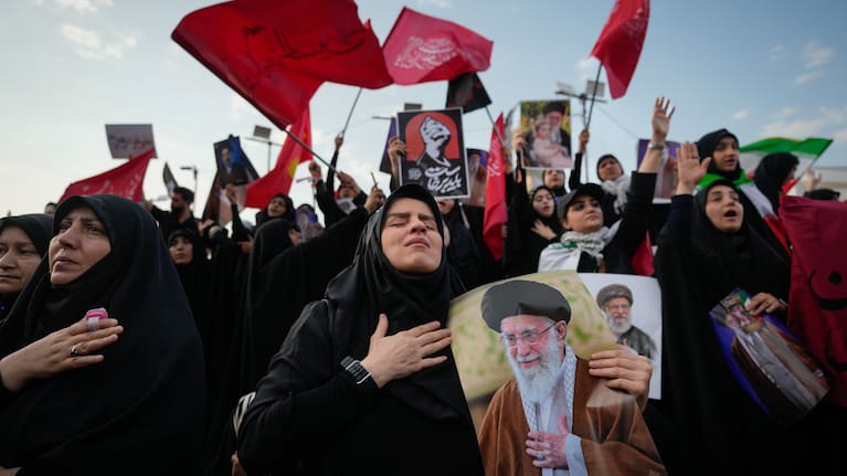 A mourner reacts while holding a portrait of the slain Iranian Supreme Leader Ayatollah Ali Khamenei as mourners gather in Islamic Revolution Square for Khamenei's funeral procession in Tehran, Iran, Monday, July 6, 2026.