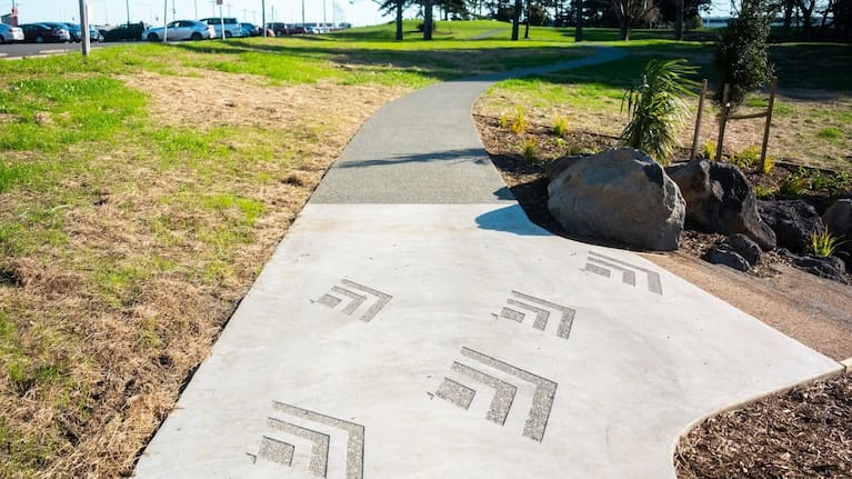 A new shared pathway at Manu-kau Noa Iho / Hayman Park features decorative design elements as part of the park's redevelopment.