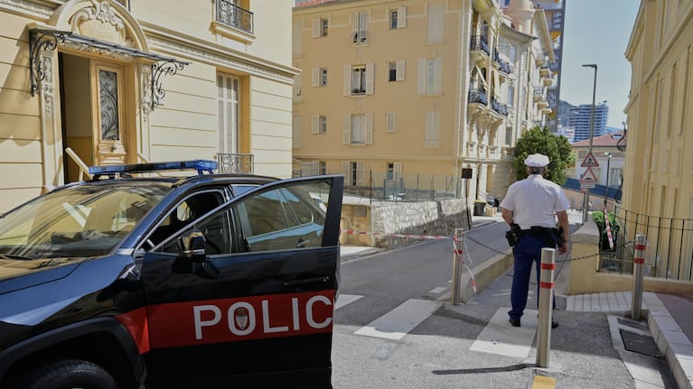 A police officer guards in a street in Monaco, Tuesday, June 30, 2026, a day after an explosive device seriously injured three people at a residential building in Monaco.