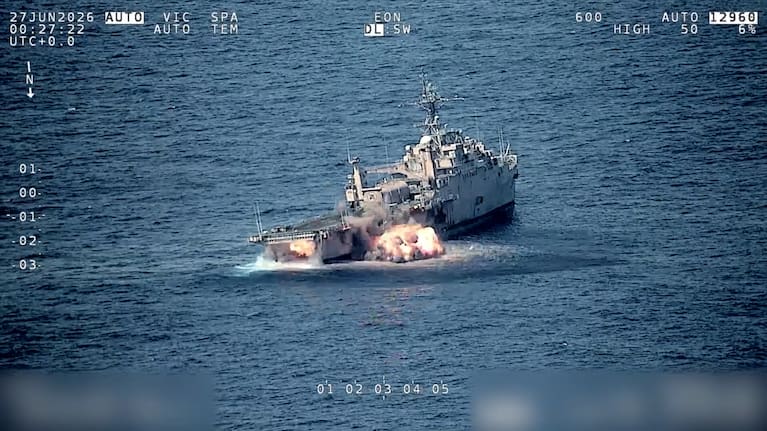 A ship is hit by two missiles fired from an RNZAF An AGM-84 Harpoon guided missile is launched from an RNZAF Poseidon.