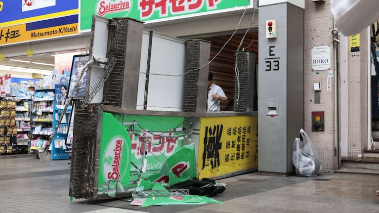 A store sign of a restaurant is seen fallen on the ground after an earthquake in Kumamoto in the Kyushu island, southern Japan.
