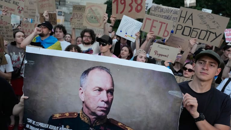 Activists hold a portrait of Ukraine's Armed Forces Commander-in-Chief Oleksandr Syrskyi demanding his resignation.