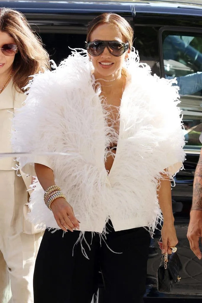 Jennifer Lopez wearing a fluffy white coat