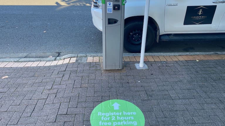 Advertising for two-hour parking is scattered around parking kiosks in the CBD. (Source: Jordan Smith / Waikato Times)