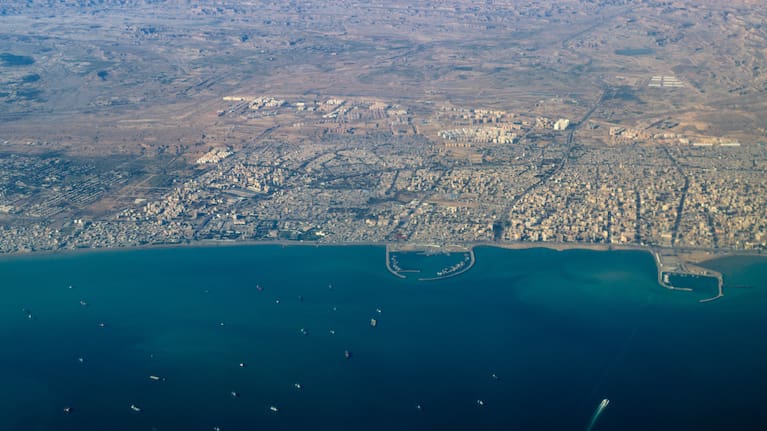 Aerial view of Bandar Abbas major Iranian Persian Gulf port city with several harbors and ship traffic, Strait of Hormuz, Iran.