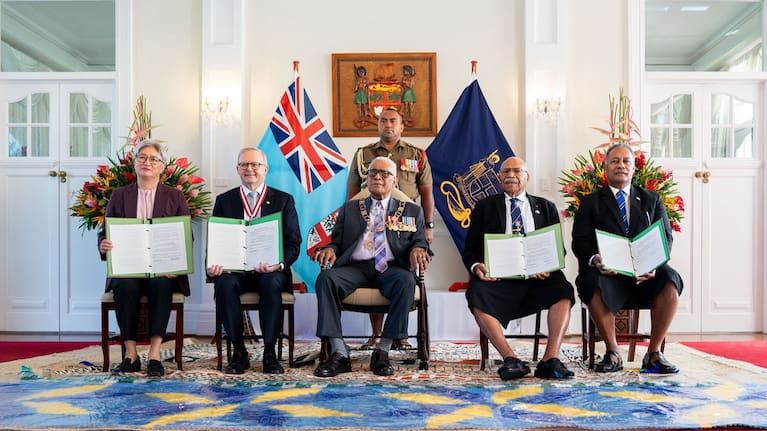 Australia and Fiji leaders at the signing of the Ocean of Peace defence alliance.