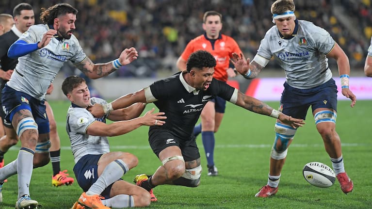 All Blacks skipper Ardie Savea loses the ball against Italy.