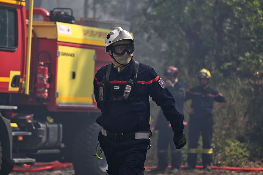 A firefighter works during a wildfire at the historic Fontainebleau forest, in France, on Monday.