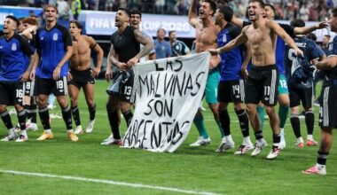Argentina players hold Falklands banner after beating England
