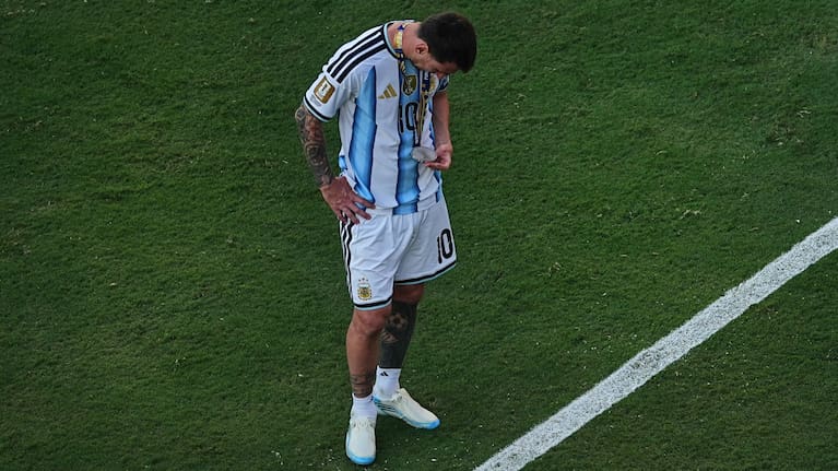 Argentina's Lionel Messi (10) checks his medal after the World Cup final soccer match between Spain and Argentina in East Rutherford, N.J., near New York, Sunday, July 19, 2026.