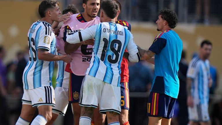 Argentina's Nicolas Otamendi (19) and Nahuel Molina (26) scuffle with Spain’s Rodri (16) after the World Cup final match between Spain and Argentina in East Rutherford.