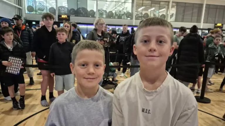 Austin (R) and his younger brother were eager to get the signatures of their favourite All Blacks.