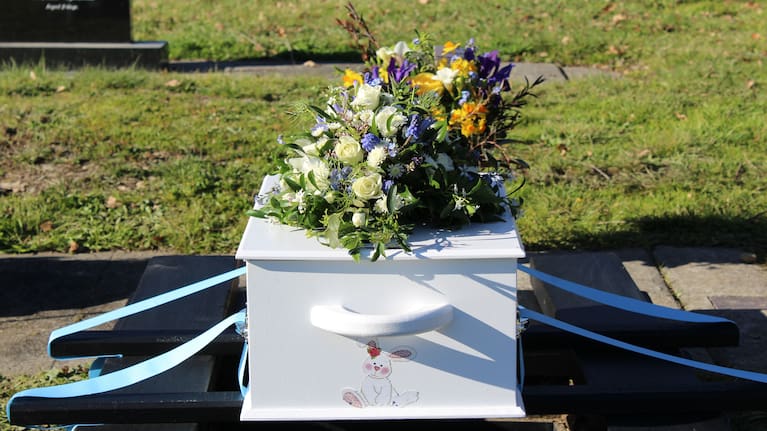 Baby Doe’s casket featured a rabbit sticker on the front and was adorned with flowers from local business Mayflower Studio Florists and ones gifted by Children’s Commissioner Claire Achmad.