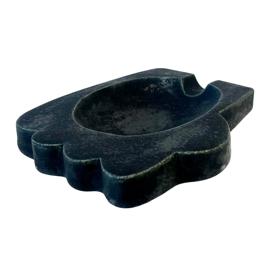 a ceramic tray in the shape of a hand