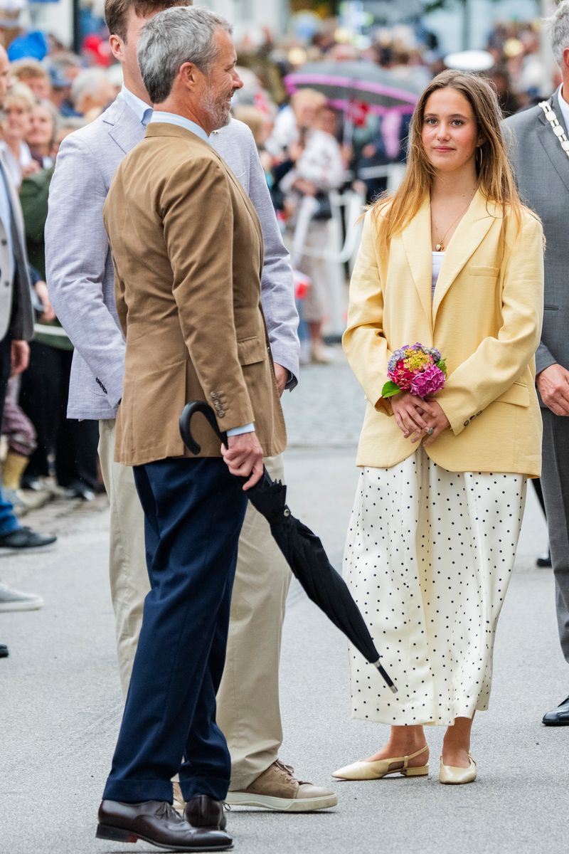 Princess Josephine embraced summer style in a butter-yellow blazer layered over a flowing polka-dot skirt during the royal family's Gråsten appearance.