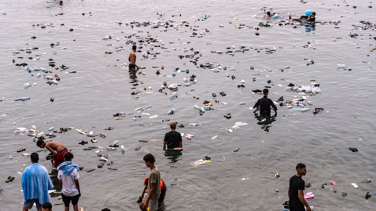 Belongings left behind by migrants float in the sea after they crossed from Morocco into the Spanish enclave of Ceuta, Friday, July 31, 2026.