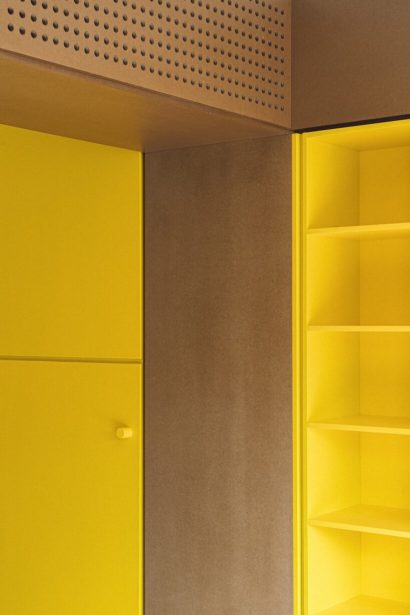 burr wraps madrid apartment in yellow storage walls with a suspended pink spiral staircase - 6