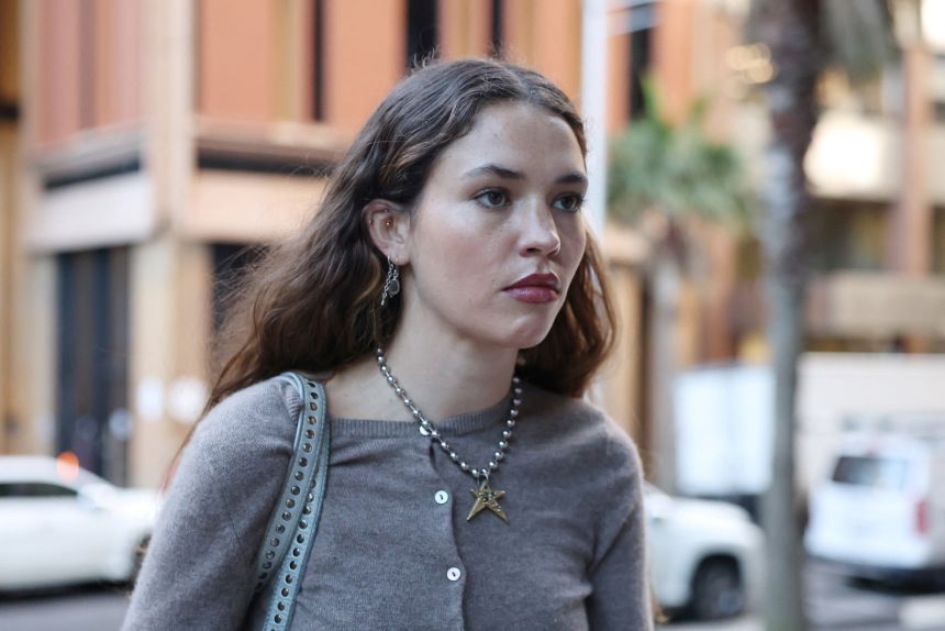 Actor Charlotte MacInnes outside a Sydney court during the defamation hearing.