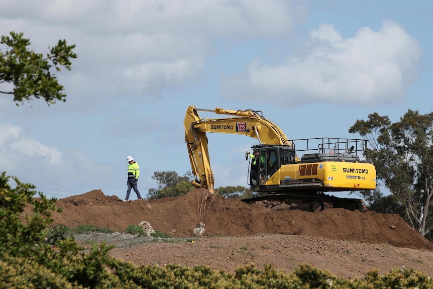 People work at a site of a new Amazon data centre.