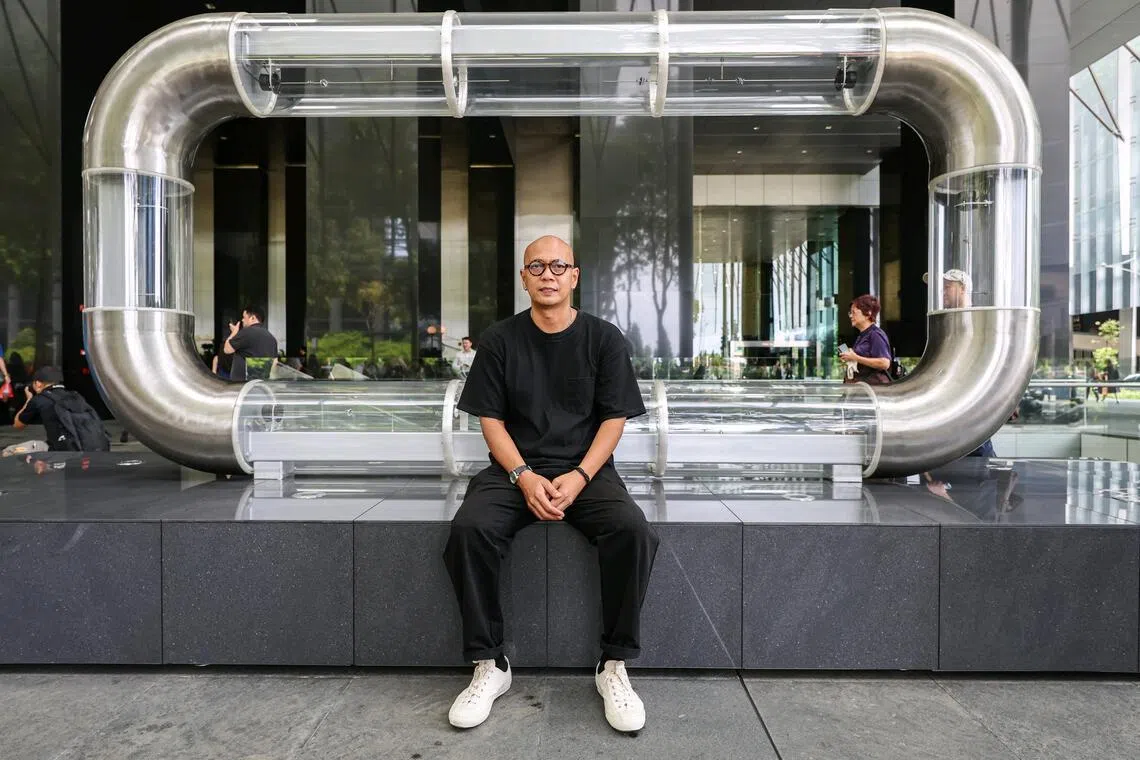 Artist Zul Mahmod with his installation LOOP - The Resonance of Motion at Asia Square (Tower 1) on July 1, 2026. The artwork is part of the Singapore Art Museum's first public art trail in Singapore's Central Business District. ST PHOTO: BRIAN TEO