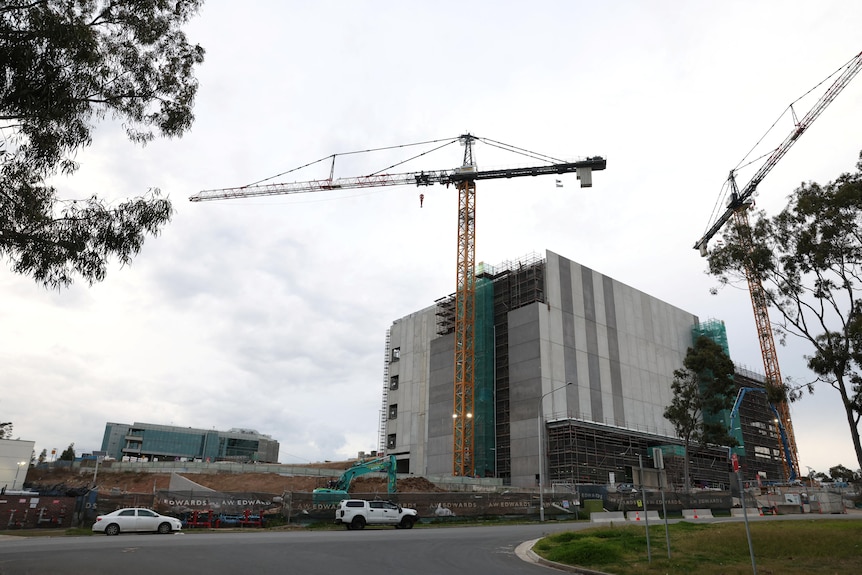 Cranes tower over the AirTrunk data centre that is under construction in Western Sydney