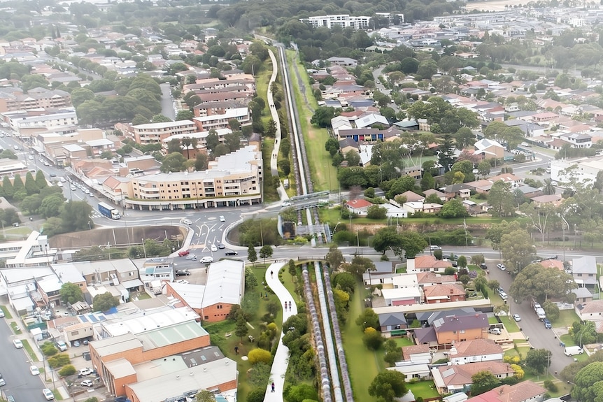 An artist's impression of walkways following an above ground water pipe running through a suburb.