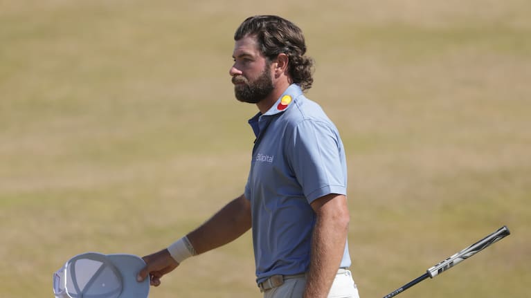 Cameron Young of the United States acknowledges the crowd as he walks off the 18th green after completing his final round during the final day of the British Open Golf championships.