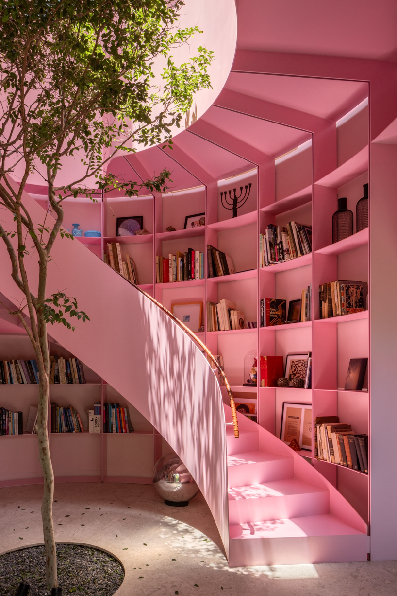 casa kiki revives a 1930s california style home around a pink turret in mexico city 4