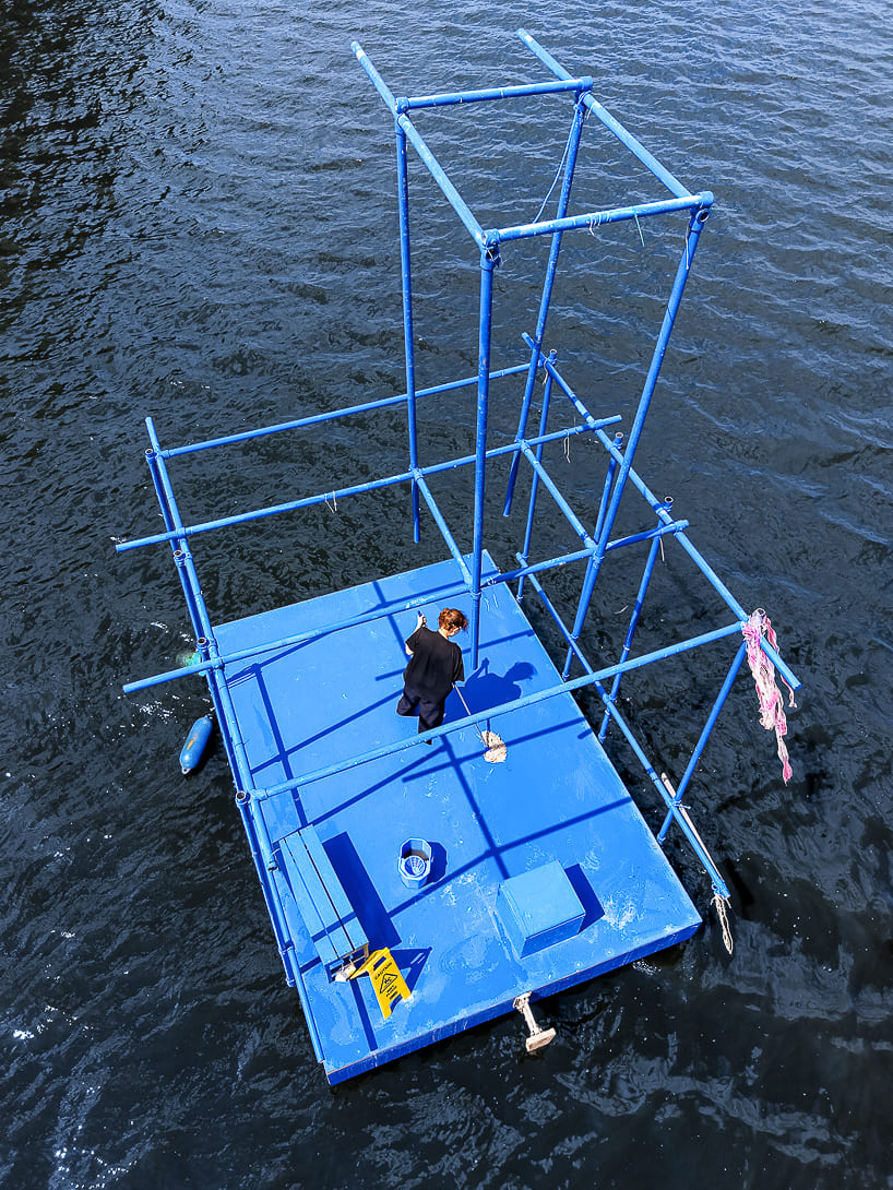 an endless act of cleaning unfolds on a floating platform in berlin - 2