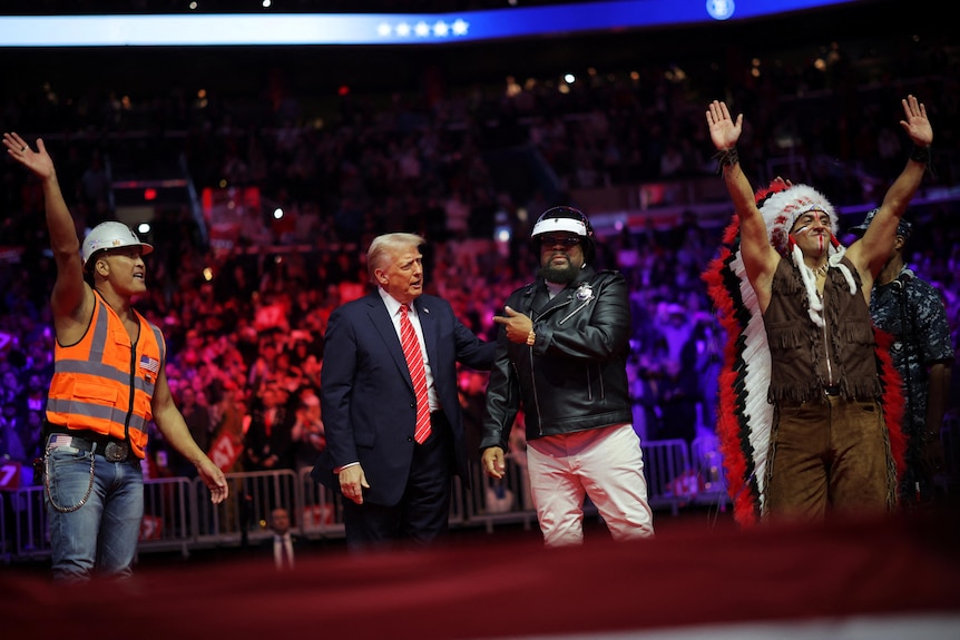 Village People members with Donald Trump on stage.