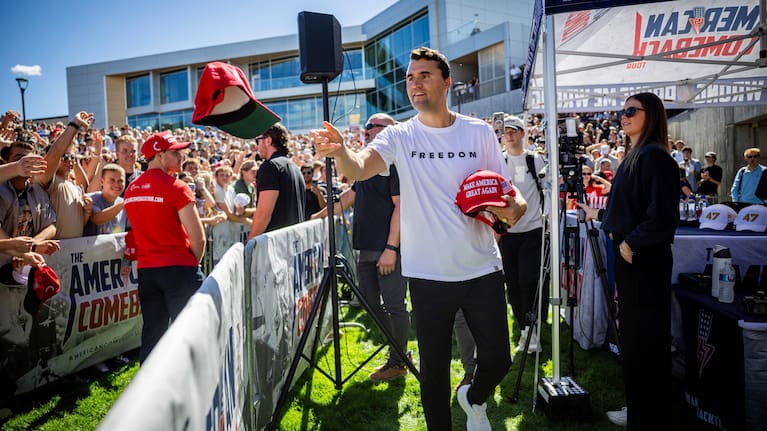 Charlie Kirk hands out hats before speaking at Utah Valley University in Orem, Utah, Sept. 10, 2025.