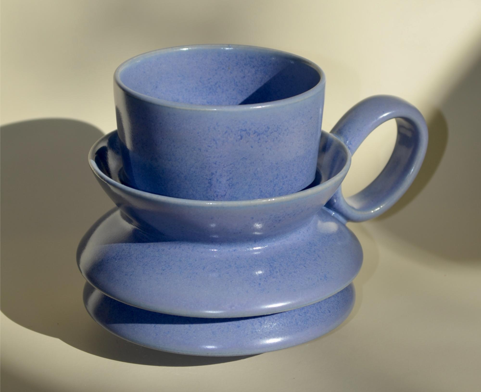 a periwinkle mug with ripples on the body