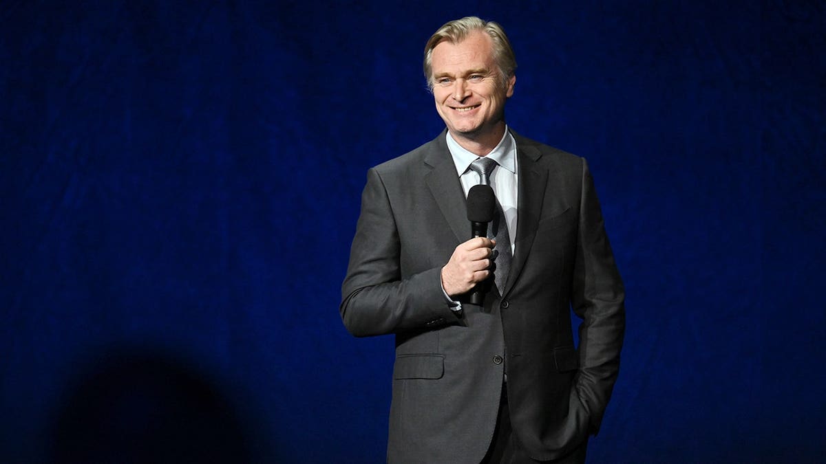 Christopher Nolan standing at the Universal Pictures and Focus Features photocall at CinemaCon