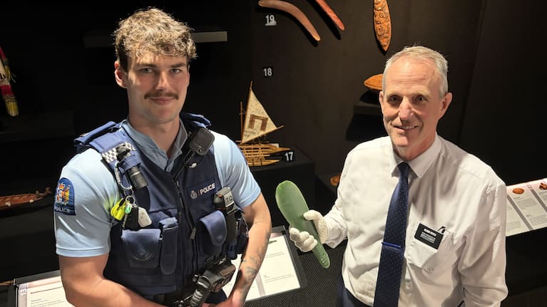 Constable Kyarn Crawford returned the mere to Matthew Cowley Church of Pacific History Centre leader Nathan Petty.