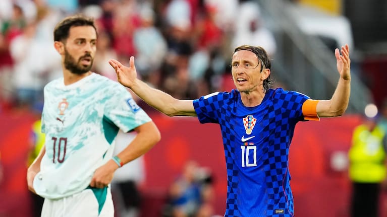 Croatia's Luka Modric (10) reacts to a call as Portugal's Bernardo Silva (10) looks on during the World Cup round of 32 match between Portugal and Croatia in Toronto.
